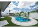 Beautiful backyard pool, new tile, and landscaping with an outdoor seating area and palm trees at 1630 E Minton Dr, Tempe, AZ 85282