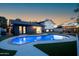 Beautiful pool and outdoor living area with mature landscaping and outdoor seating at dusk at 1630 E Minton Dr, Tempe, AZ 85282