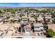 An aerial view of a residential area with homes, landscaping, and one with a pool and solar panels at 17258 W Meghan Dr, Goodyear, AZ 85338
