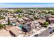 An aerial view of a residential area with homes, landscaping, and one with a pool and solar panels at 17258 W Meghan Dr, Goodyear, AZ 85338