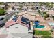 An aerial shot of the house with backyard pool, solar panels, landscaping and surrounding neighborhood at 17258 W Meghan Dr, Goodyear, AZ 85338