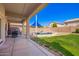 View of the backyard with a covered patio and pool at 17258 W Meghan Dr, Goodyear, AZ 85338