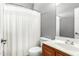 Bathroom featuring a wood vanity and shower with a white curtain at 17258 W Meghan Dr, Goodyear, AZ 85338