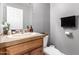 Bathroom features a wood vanity with neutral countertop at 17258 W Meghan Dr, Goodyear, AZ 85338