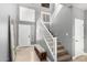 Bright foyer with stairs and neutral decor creating an inviting entrance to the home at 17258 W Meghan Dr, Goodyear, AZ 85338