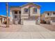 Charming two-story home with a two-car garage, a lovely facade, and a well-maintained desert landscape at 17258 W Meghan Dr, Goodyear, AZ 85338