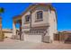 Charming two-story home with a two-car garage, desert landscaping and an inviting front entrance at 17258 W Meghan Dr, Goodyear, AZ 85338
