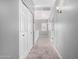 Upstairs hallway features carpet, a skylight, closet and neutral decor for a serene and functional space at 17258 W Meghan Dr, Goodyear, AZ 85338