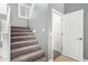 Carpeted staircase leads to the next level, enhanced by natural light from the window and an accessible storage closet at 17258 W Meghan Dr, Goodyear, AZ 85338