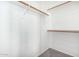 Bright, walk-in closet with built-in shelving and hanging rods, maximizes storage and organization at 17258 W Meghan Dr, Goodyear, AZ 85338
