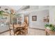 Dining room featuring an octagonal wooden table, tiled floors, and sliding glass doors at 1739 E Knox Rd, Tempe, AZ 85284