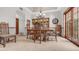 Formal dining room showcasing a chandelier, built-in hutch, and traditional furnishings at 1739 E Knox Rd, Tempe, AZ 85284