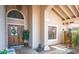 Charming front porch featuring a decorative glass door, stone walkway, and a cozy seating area at 1739 E Knox Rd, Tempe, AZ 85284