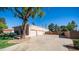 Large driveway leads to a two-car garage in this tan single Gathering home at 1739 E Knox Rd, Tempe, AZ 85284