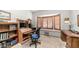 Inviting home office with built-in desk, shelving, and a cozy window seat with shutters at 1739 E Knox Rd, Tempe, AZ 85284