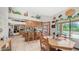 Open kitchen and dining area with tile floors and views of the backyard pool at 1739 E Knox Rd, Tempe, AZ 85284