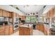 Spacious kitchen with island and granite countertops, ample wood cabinets, and modern appliances at 1739 E Knox Rd, Tempe, AZ 85284