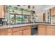 Kitchen with granite countertops, dark appliances, and a view of the backyard pool at 1739 E Knox Rd, Tempe, AZ 85284