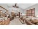 Bright living room featuring vaulted ceilings, comfortable seating, and a dining area at 1739 E Knox Rd, Tempe, AZ 85284