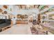 Expansive living room with a bar, beamed ceilings, and open layout is perfect for entertaining at 1739 E Knox Rd, Tempe, AZ 85284