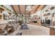 Large living room boasts beamed ceilings, fireplace, and French doors opening to an outdoor pool at 1739 E Knox Rd, Tempe, AZ 85284