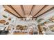 High ceilings with beams, arches and open shelves with decor gives this living room a unique style at 1739 E Knox Rd, Tempe, AZ 85284
