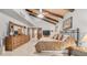Spacious main bedroom features a vaulted ceiling with wood beams, carpet floors, and a dresser at 1739 E Knox Rd, Tempe, AZ 85284