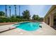Backyard pool featuring a diving board and lush green landscaping at 1739 E Knox Rd, Tempe, AZ 85284
