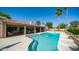Stunning pool with a covered patio and bar area, perfect for outdoor entertaining with palm trees around at 1739 E Knox Rd, Tempe, AZ 85284