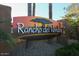 Close-up of the Rancho del Verde community entrance sign with mature landscaping at 174 W Del Rio St, Gilbert, AZ 85233