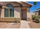 Inviting front entrance with a well-maintained walkway and desert landscaping at 174 W Del Rio St, Gilbert, AZ 85233