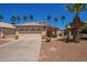 Charming home with a neutral color scheme, a two-car garage, and landscaping including blooming bushes and palm trees at 174 W Del Rio St, Gilbert, AZ 85233