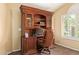 Elegant home office with custom wood built-ins and a comfortable leather chair at 174 W Del Rio St, Gilbert, AZ 85233