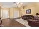 Open-concept living room with wood-look floors and ample natural light at 174 W Del Rio St, Gilbert, AZ 85233