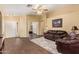 Open-concept living room with wood-look floors and ample natural light at 174 W Del Rio St, Gilbert, AZ 85233