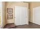 Bonus room with tile flooring, closet, and leather footstool at 174 W Del Rio St, Gilbert, AZ 85233