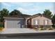Charming single-story home featuring stone accents, gray shutters, and a two-car garage at 17709 W Ford St, Goodyear, AZ 85338