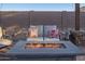 Outdoor space with fire pit, cozy seating, and a warm ambiance for relaxation and entertainment at 17913 E Watford Dr, Queen Creek, AZ 85142
