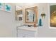 Stylish bathroom featuring a framed mirror, modern sink, and elegant decor at 17913 E Watford Dr, Queen Creek, AZ 85142