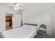 Inviting bedroom with white quilt, wood-look flooring just outside the door, and a calming atmosphere at 17913 E Watford Dr, Queen Creek, AZ 85142