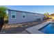 Back exterior with a pool and pavers plus a gravel area around the house at 17913 E Watford Dr, Queen Creek, AZ 85142
