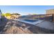 A refreshing pool with a gazebo, lounge seating, and a well-maintained patio at 17913 E Watford Dr, Queen Creek, AZ 85142