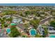 Overhead view of a residential neighborhood with lush landscaping and swimming pools at 1817 W Seldon Ln, Phoenix, AZ 85021