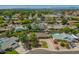 Extensive aerial view of a well-kept neighborhood featuring homes with mature trees and in-ground pools at 1817 W Seldon Ln, Phoenix, AZ 85021