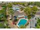 Aerial view of a private pool in a lush backyard with mature landscaping and outdoor seating at 1817 W Seldon Ln, Phoenix, AZ 85021