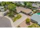 Aerial view of home showcasing a large driveway, mature landscaping, and inviting pool at 1817 W Seldon Ln, Phoenix, AZ 85021