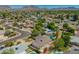 Wide aerial view of a neighborhood showcasing numerous homes, swimming pools, and mountain views at 1817 W Seldon Ln, Phoenix, AZ 85021