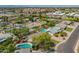 Expansive aerial view of a neighborhood featuring mature trees and private backyard pools at 1817 W Seldon Ln, Phoenix, AZ 85021
