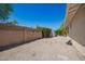 A spacious backyard features a block wall, gravel landscaping, and a convenient storage shed at 1817 W Seldon Ln, Phoenix, AZ 85021