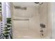 Cozy bathroom featuring a shower with shower head, soap racks, and tropical themed shower curtain at 1817 W Seldon Ln, Phoenix, AZ 85021